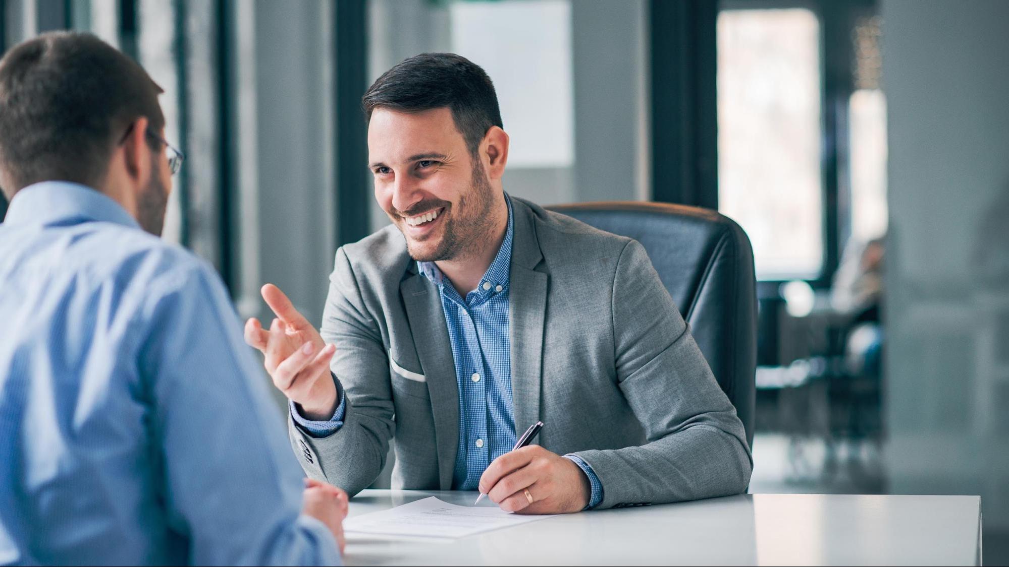 Smiling lawyer meeting with client